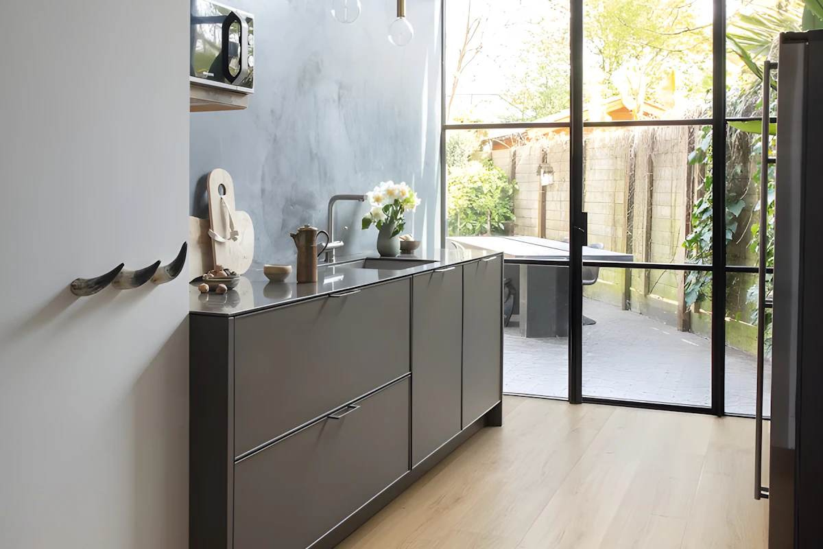 A kitchen opening onto a garden, from the Morrow & Beam demo